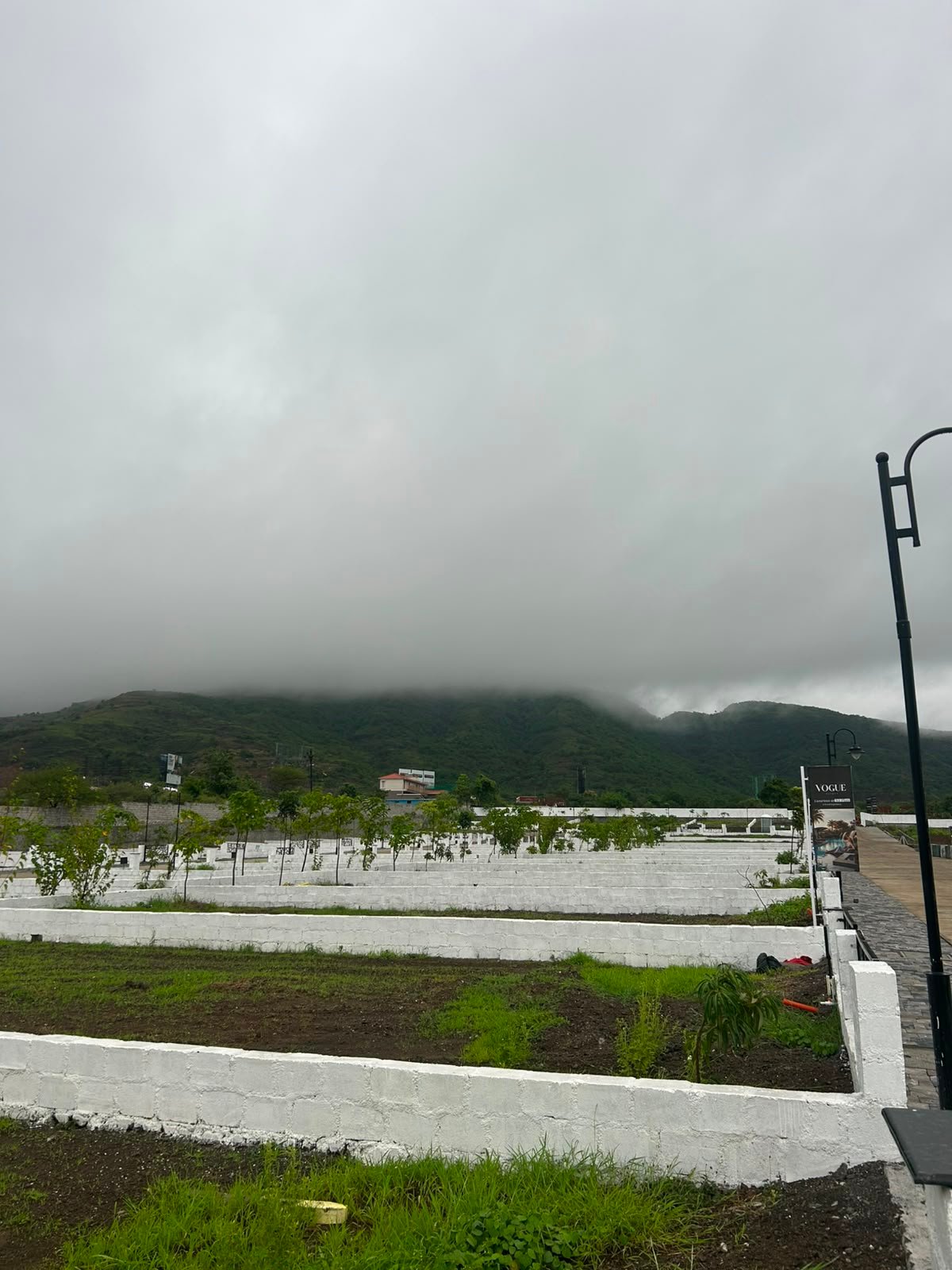 Vouge Estate — plotted development with monsoon hills